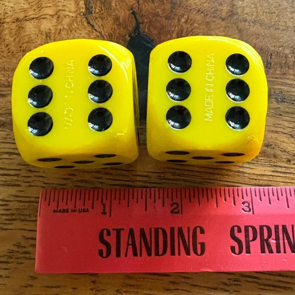 Vintage pair of yellow and black large dice